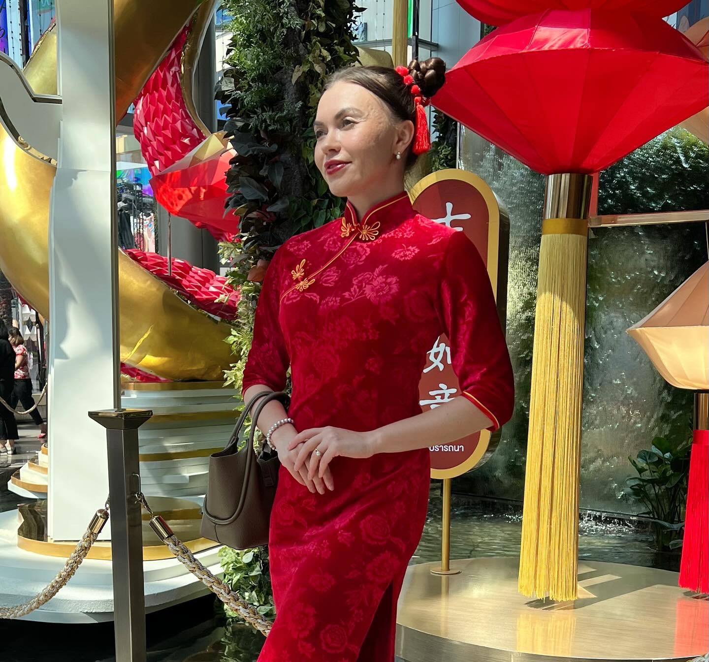 Alisa wearing traditional dress while travelling